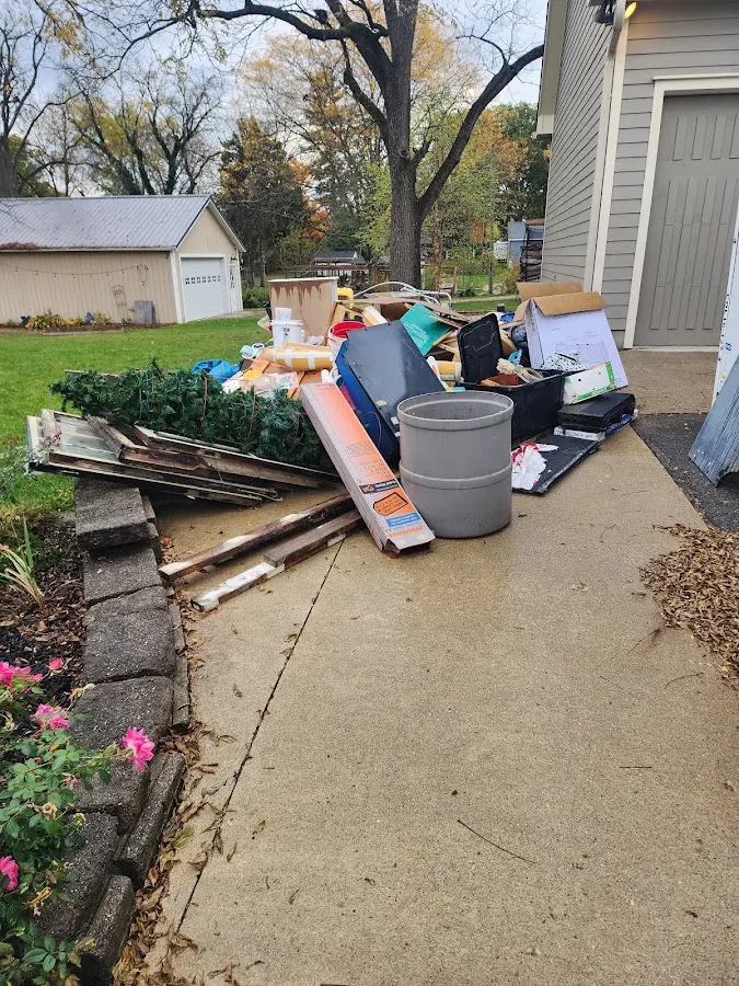 Dumpster being loaded with debris for Roofing Dumpster Rental in Antigo